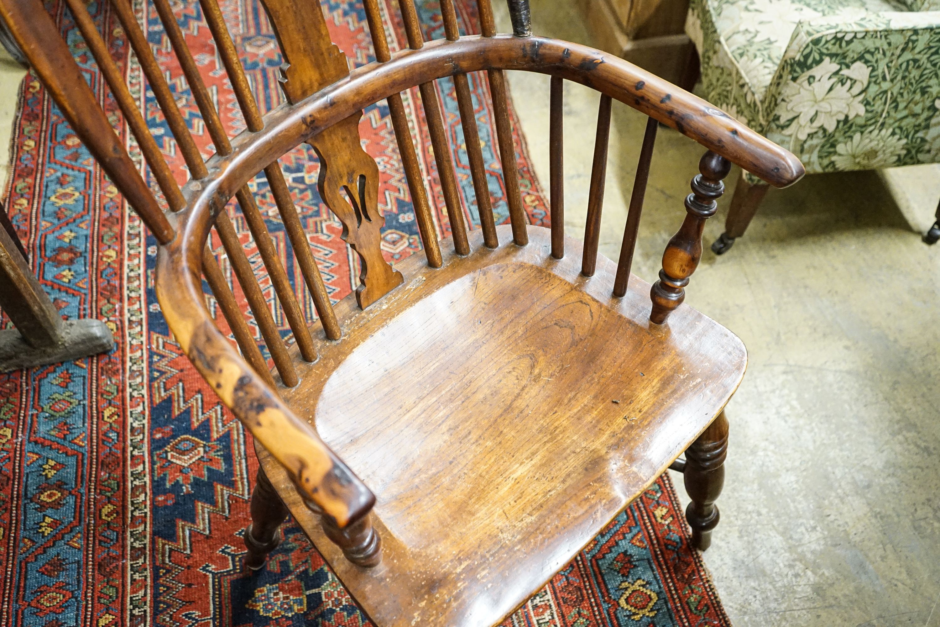 A harlequin set of four Victorian Windsor chairs, comprising near pair of yew, beech and elm, with crinoline stretchers and two others in oak, elm and ash with H stretchers